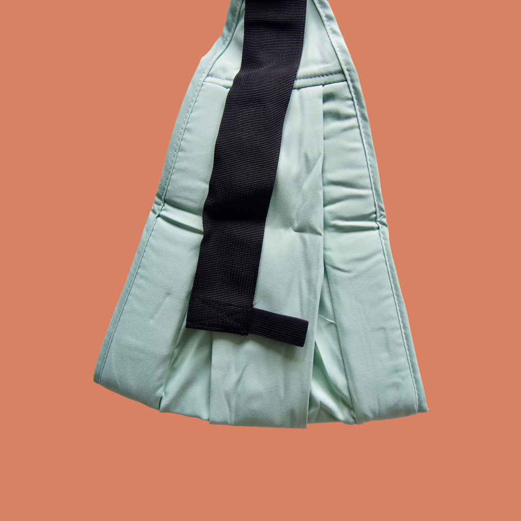 Mint green ergonomic baby carrier back bucket view - soft-structured carrier with adjustable straps