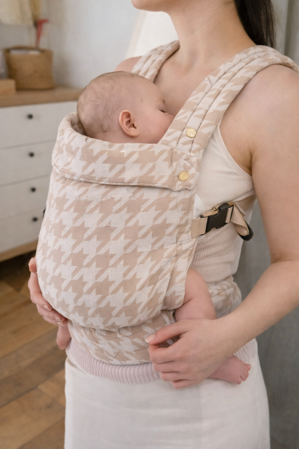 Parent wearing beige houndstooth ergonomic baby carrier with infant - soft-structured toddler sling carrier UK