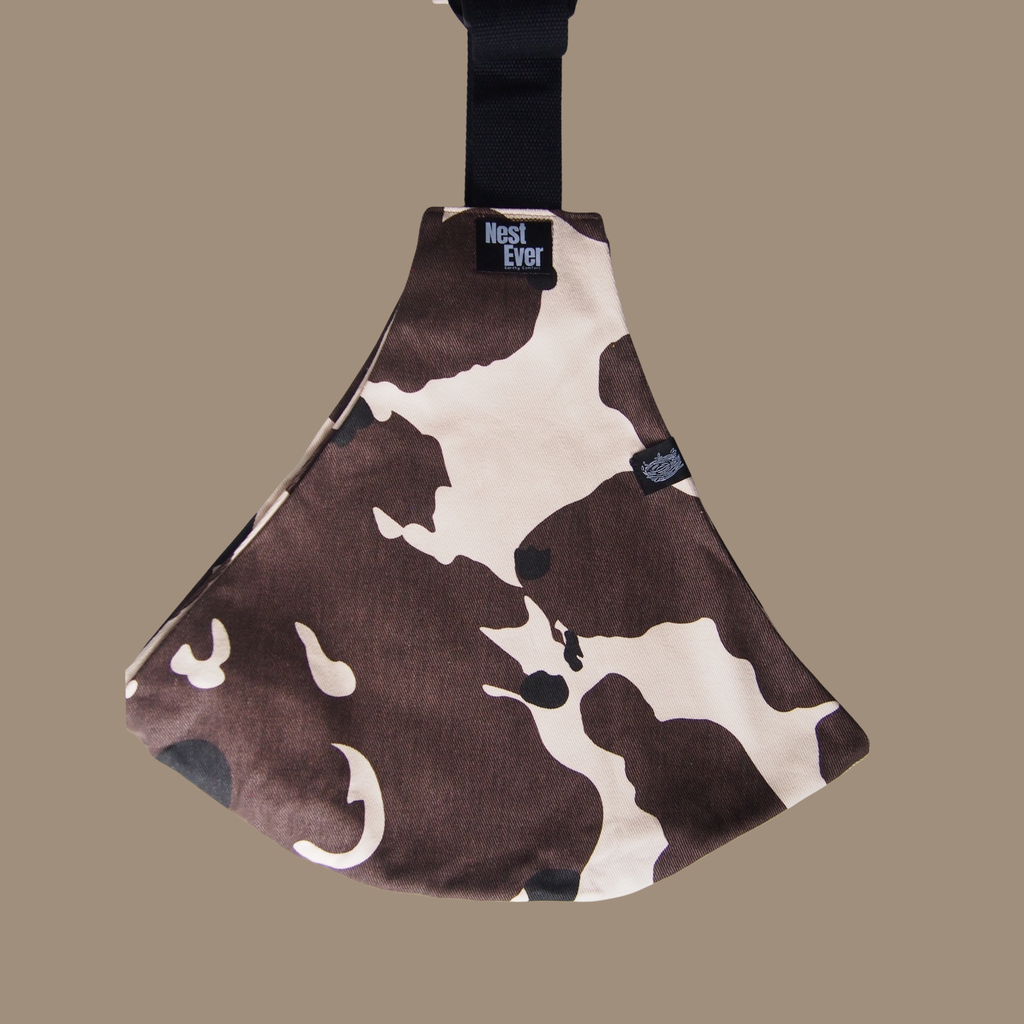 Cow pattern toddler hip carrier view - lightweight baby carrier