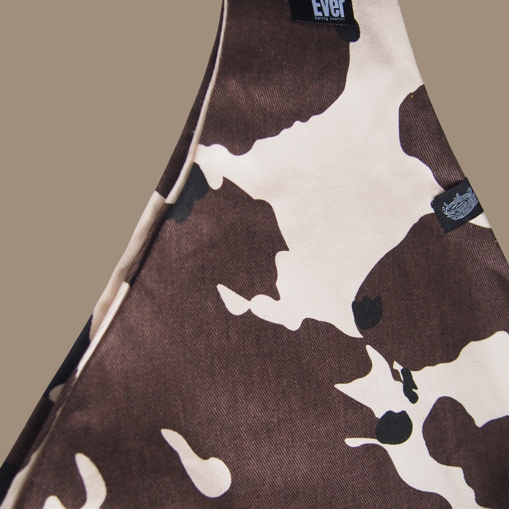 Cow pattern toddler hip carrier view - lightweight baby carrier