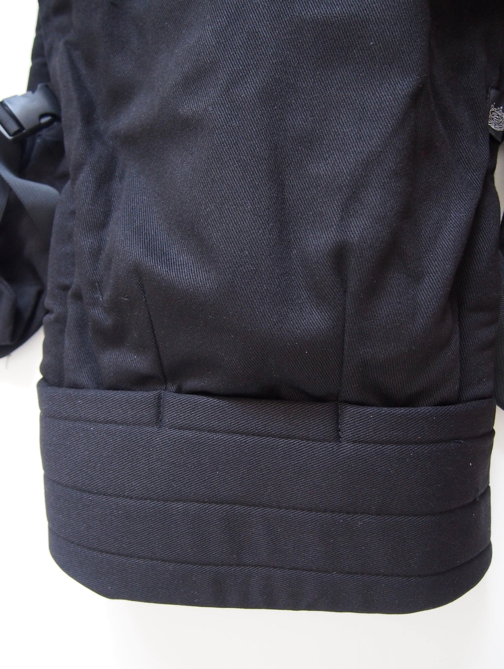 Black ergonomic baby carrier back view - soft-structured carrier with adjustable straps