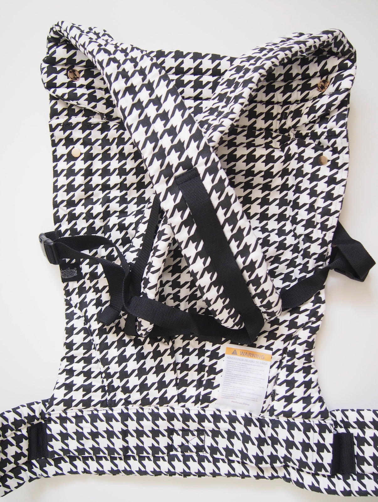 Black houndstooth ergonomic baby carrier back view - soft-structured carrier with adjustable straps